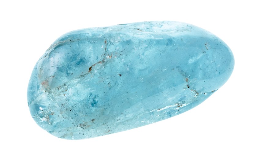 tumbled aquamarine (blue beryl) gemstone cutout on white background