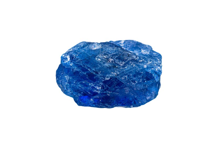 Rare natural rough Burmese royal blue sapphire gemstone on white background (corundum gemstone group)(selective focus)